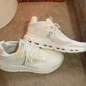 On Running White and Green Athletic Shoes
